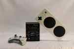 A standard controller, adroit, and Xbox adaptive controller