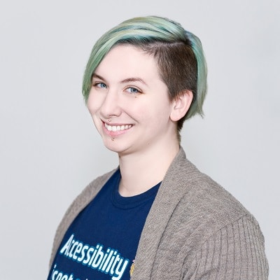 A head and shoulders headshot of Sam