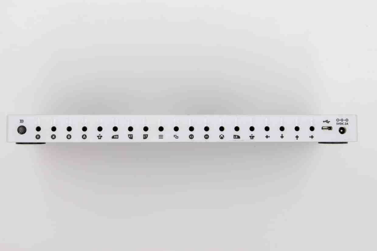 The various ports on the back of an Xbox Adaptive Controller. There are icons below each port indicating what input it represents.