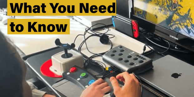 a photo of two people using adaptive gaming equipment to play a video game