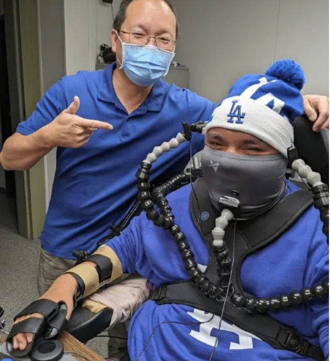 Andy Lin with Mr. R, who is using a custom adapted gaming setup using both 3D printed and commercially available components.