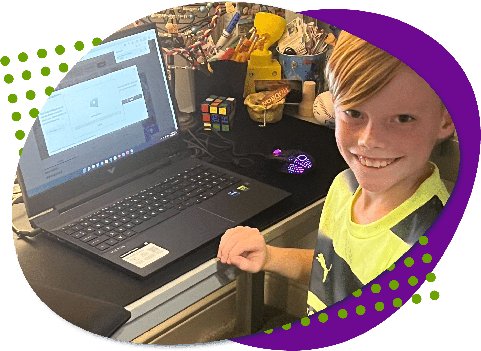 Hudson large stack Husdon, a young man born with a limb difference looking at the camera with his new gaming laptop he just got.