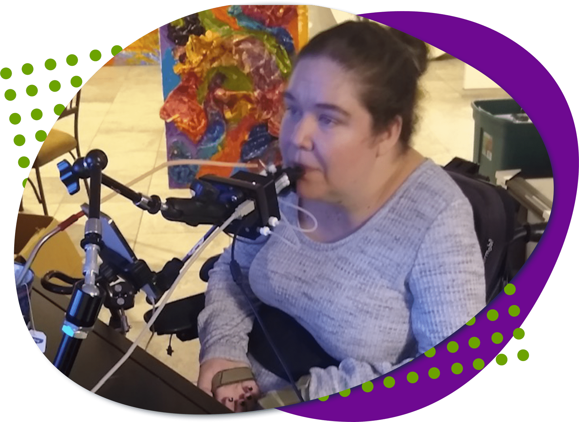 Jessica, a Caucasian female using a quadstick, a controller that you use your mouth with.