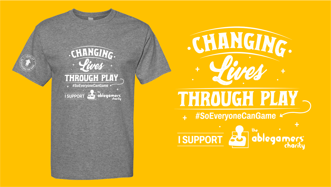 level up t2 an image showing our "Changing Lives" short sleeve gray shirt with white imprint on front a sleeve and text that says 'Changing Lives Through Play, I support the AbleGamers Charity