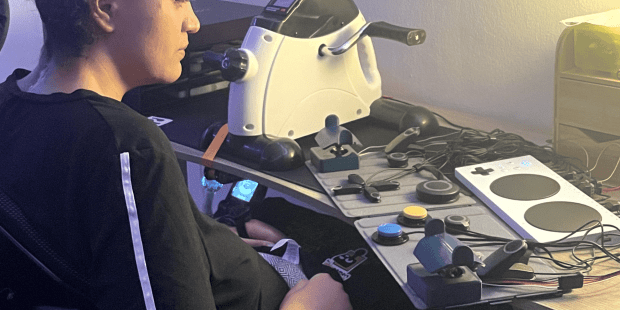 Nathalie looking over her switches and Microsoft XAC as she readies to play