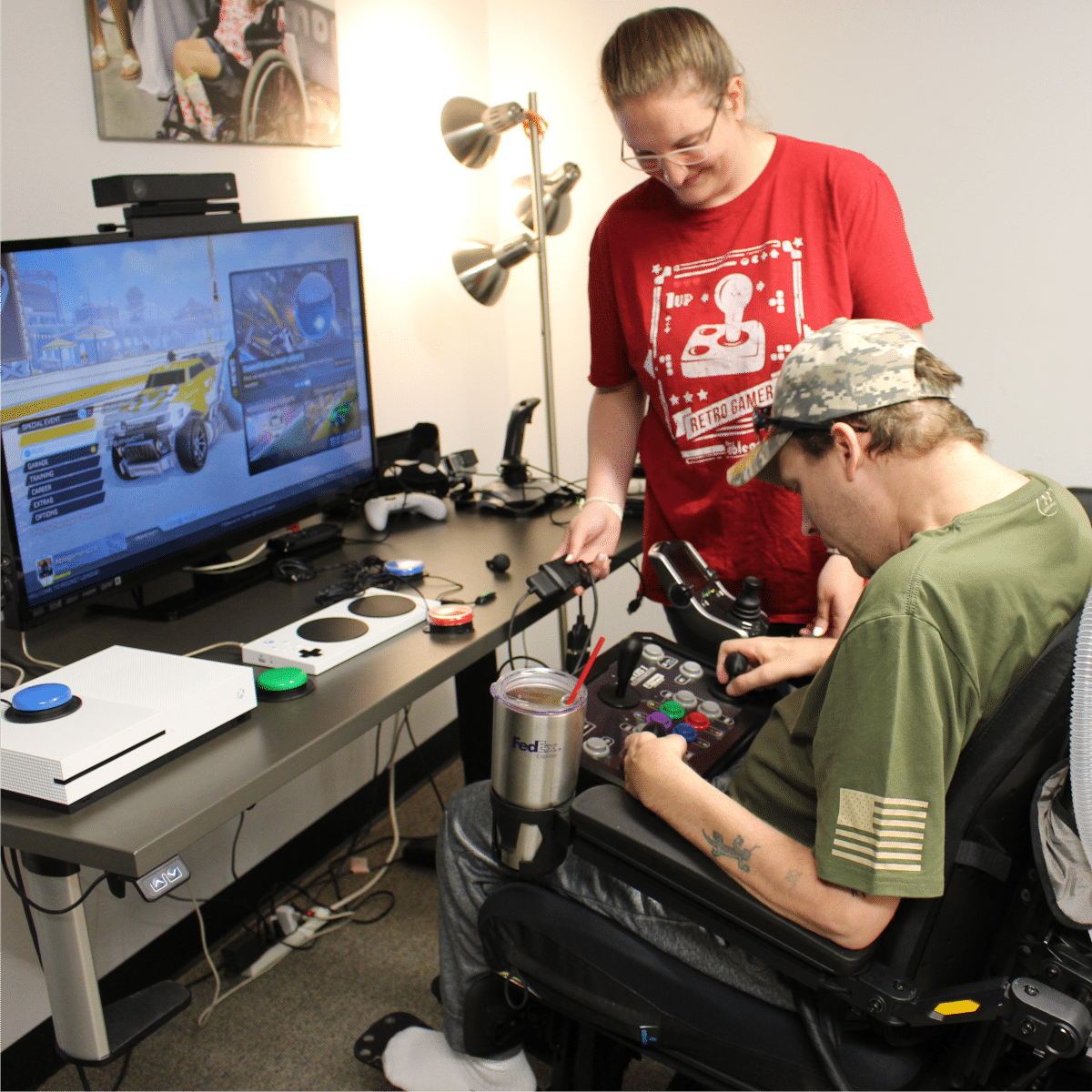 peer for web AbleGamers Peer Counselor working with a young man who is using a wheelchair to find the right set up to game. Support peer counseling, host a fundraiser!